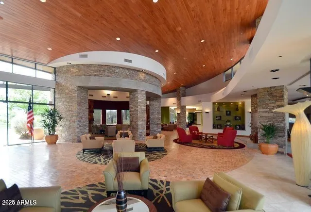 a view of living room with furniture and floor to ceiling window