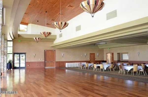 a living room with lots of furniture and wooden floor