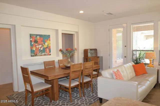 a kitchen with stainless steel appliances granite countertop a refrigerator a sink a stove and a oven