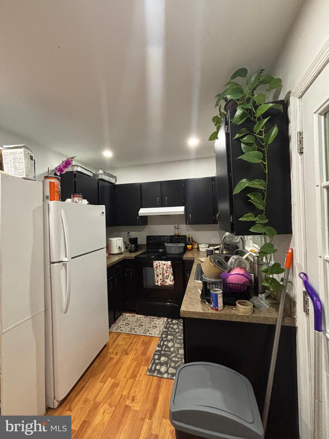 6004 Simplicity Court Chesterfield, VA 23832 - Photo 6 of 17 a kitchen with a refrigerator and a stove