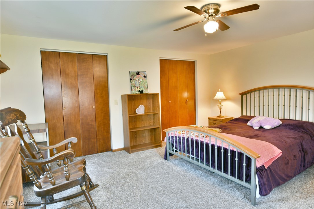 1509 State Road Northwest Warren, OH 44481 - Photo 34 of 49 Bedroom featuring ceiling fan and light carpet