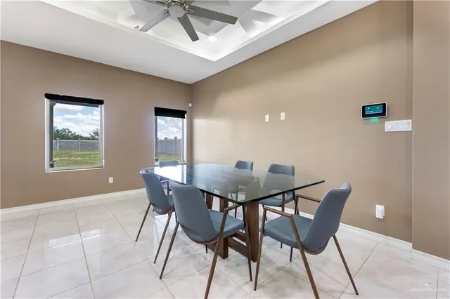 a view of a dining room with furniture and window