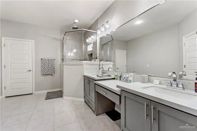 a bathroom with a sink vanity and mirror