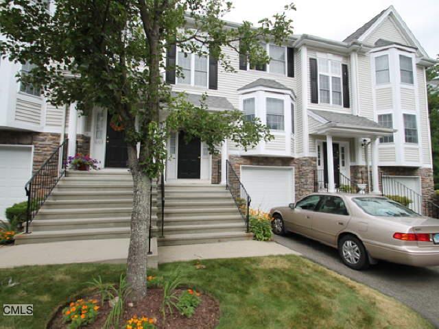 1004 Cypress Drive, Unit 1004 Danbury, CT 06811 - Photo 1 of 1 a car parked in front of a house