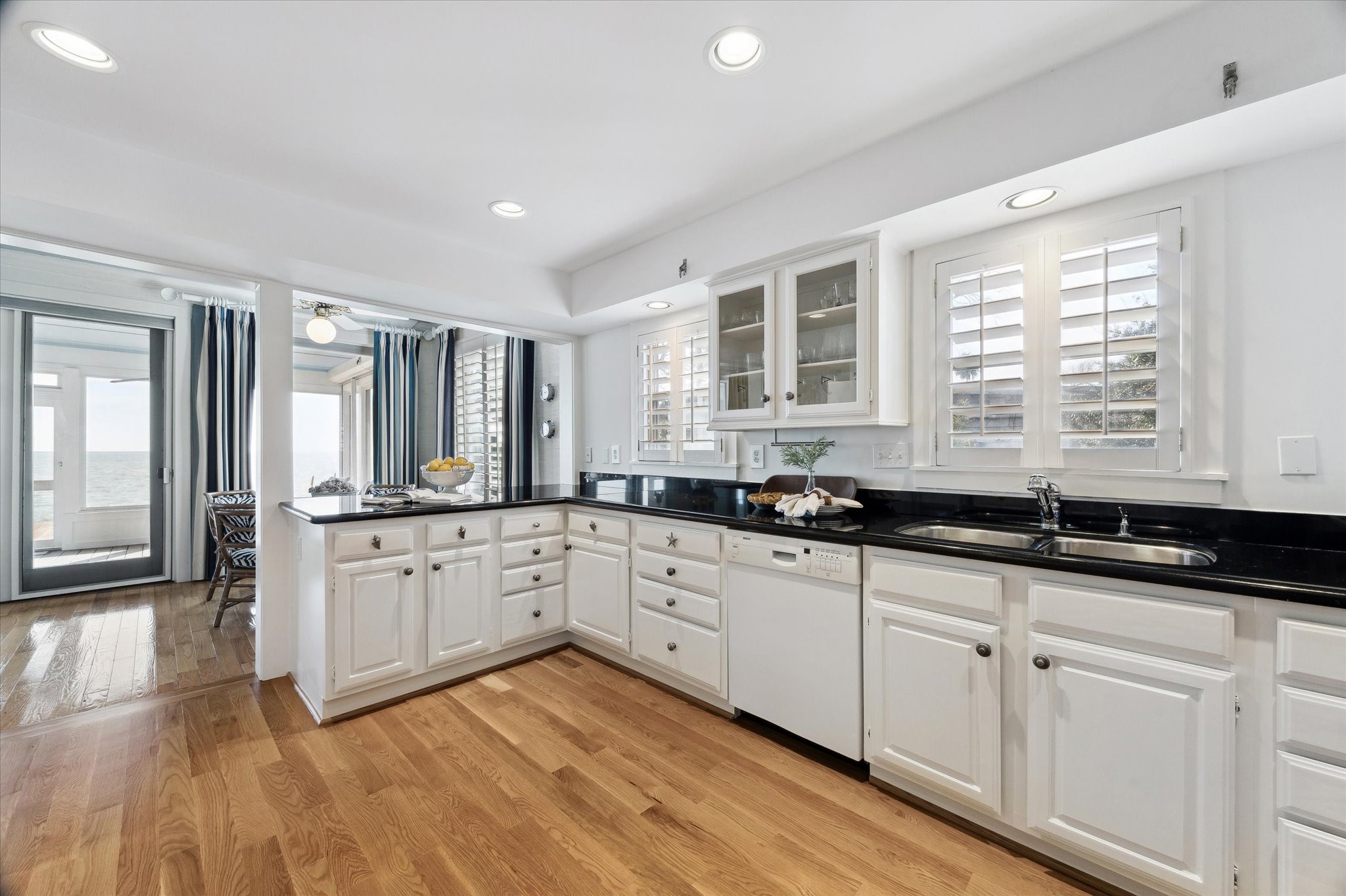 232 Garfield Street La Porte, TX 77571 - Photo 12 of 35 a large kitchen with granite countertop a sink and cabinets