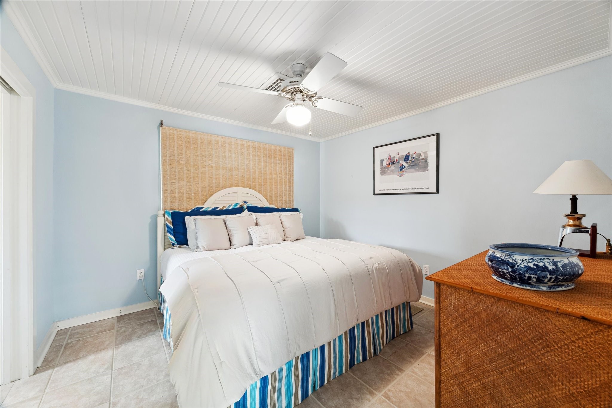 232 Garfield Street La Porte, TX 77571 - Photo 31 of 35 a bedroom with a bed and a lamp on dresser