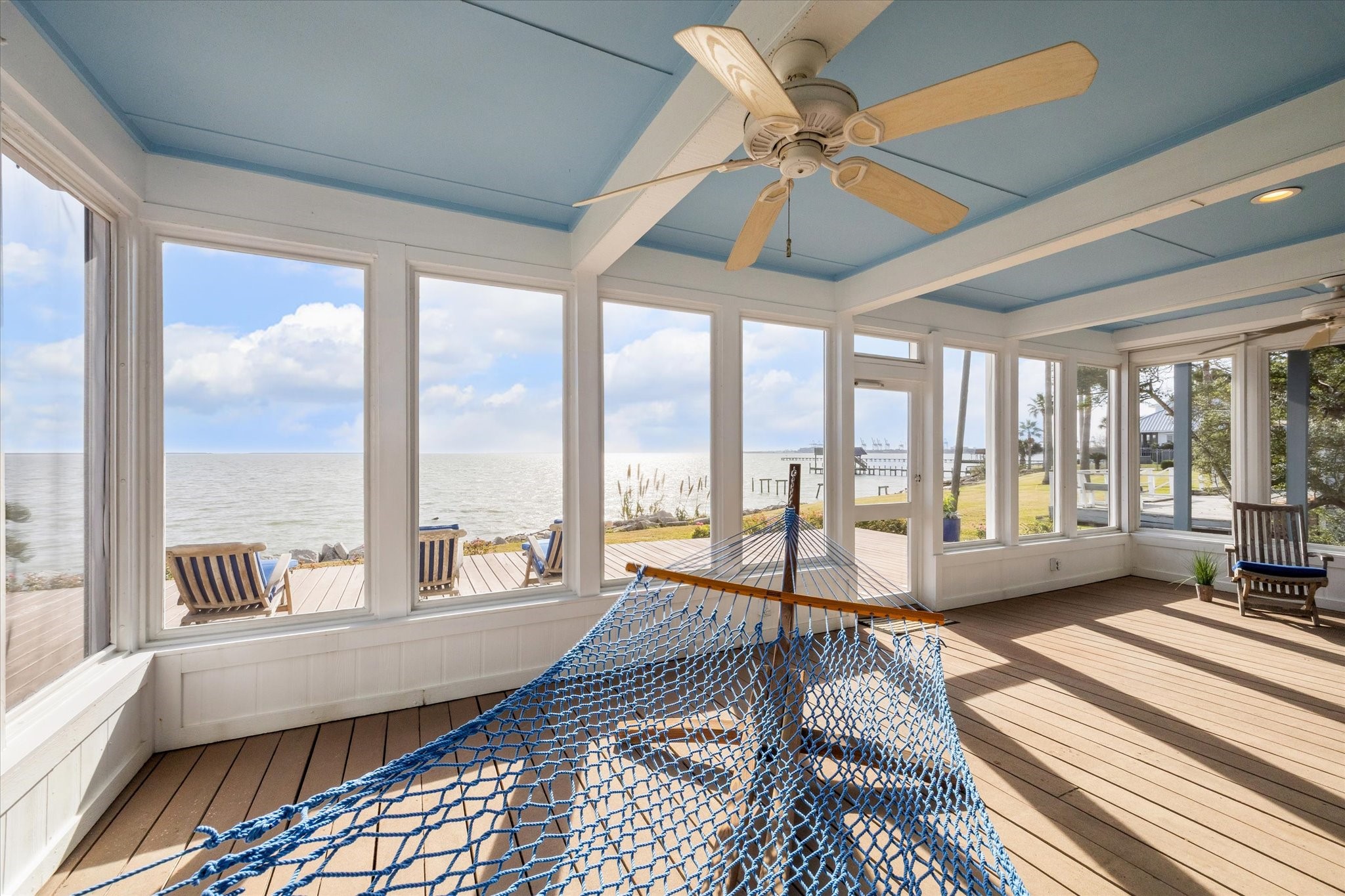 232 Garfield Street La Porte, TX 77571 - Photo 8 of 35 a spacious bedroom with a large window and a balcony