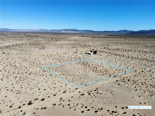 a view of an ocean beach and a mountain