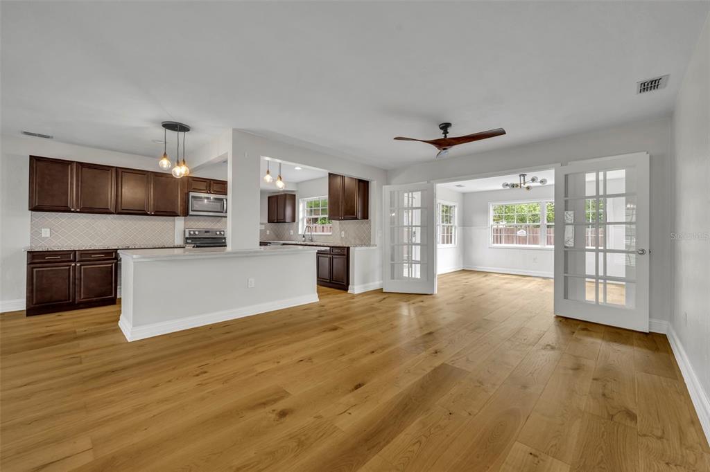 4234 Kendrick Road Orlando, FL 32804 - Photo 6 of 46 a view of a kitchen with a stove cabinets and wooden floor