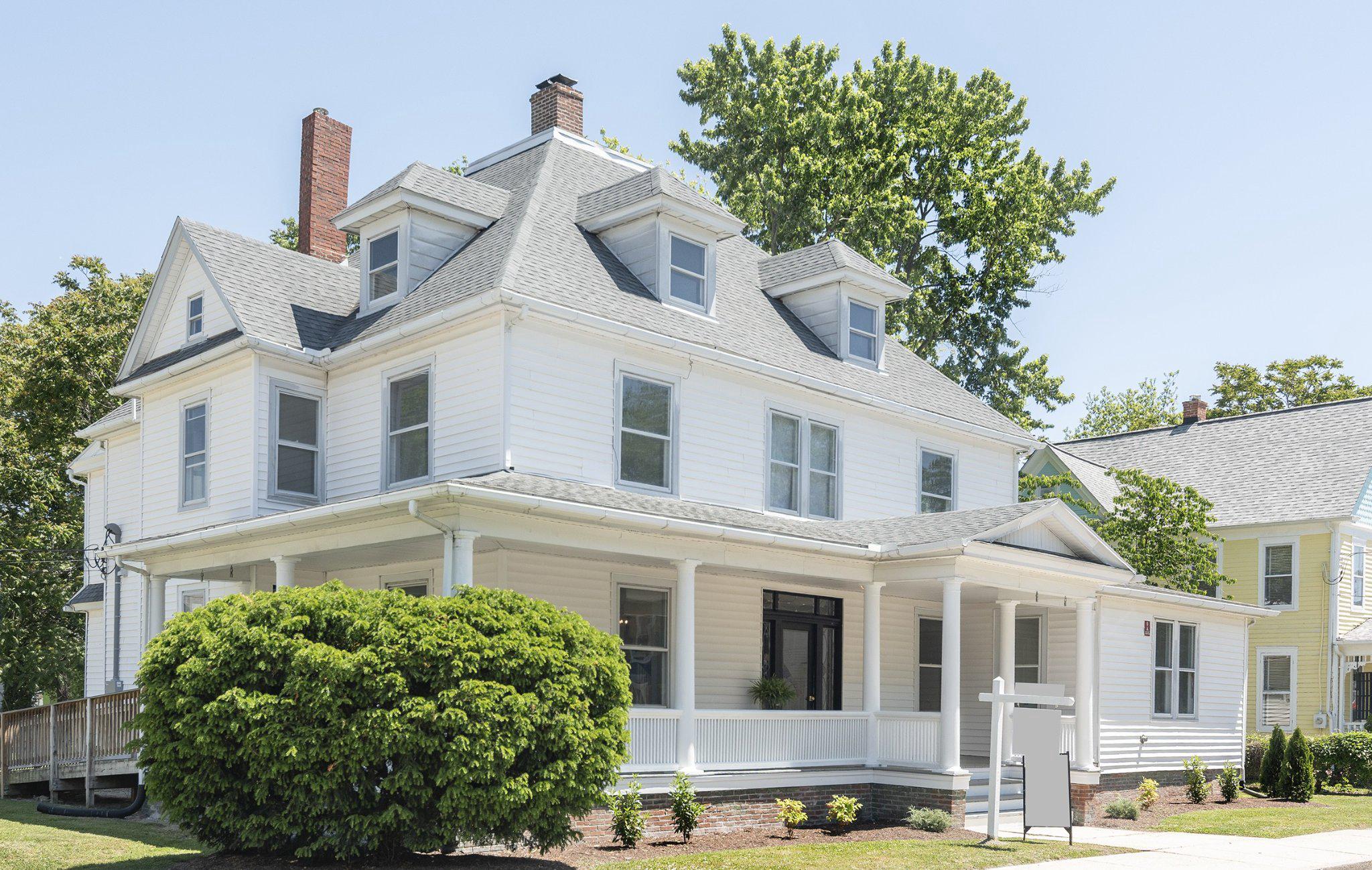 709 Church Street Cambridge, MD 21613 - Photo 1 of 36 a front view of a building with a garden