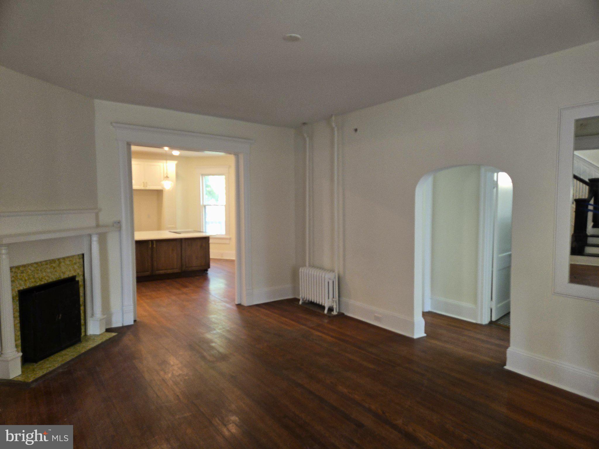Spacious living area with vintage charm.