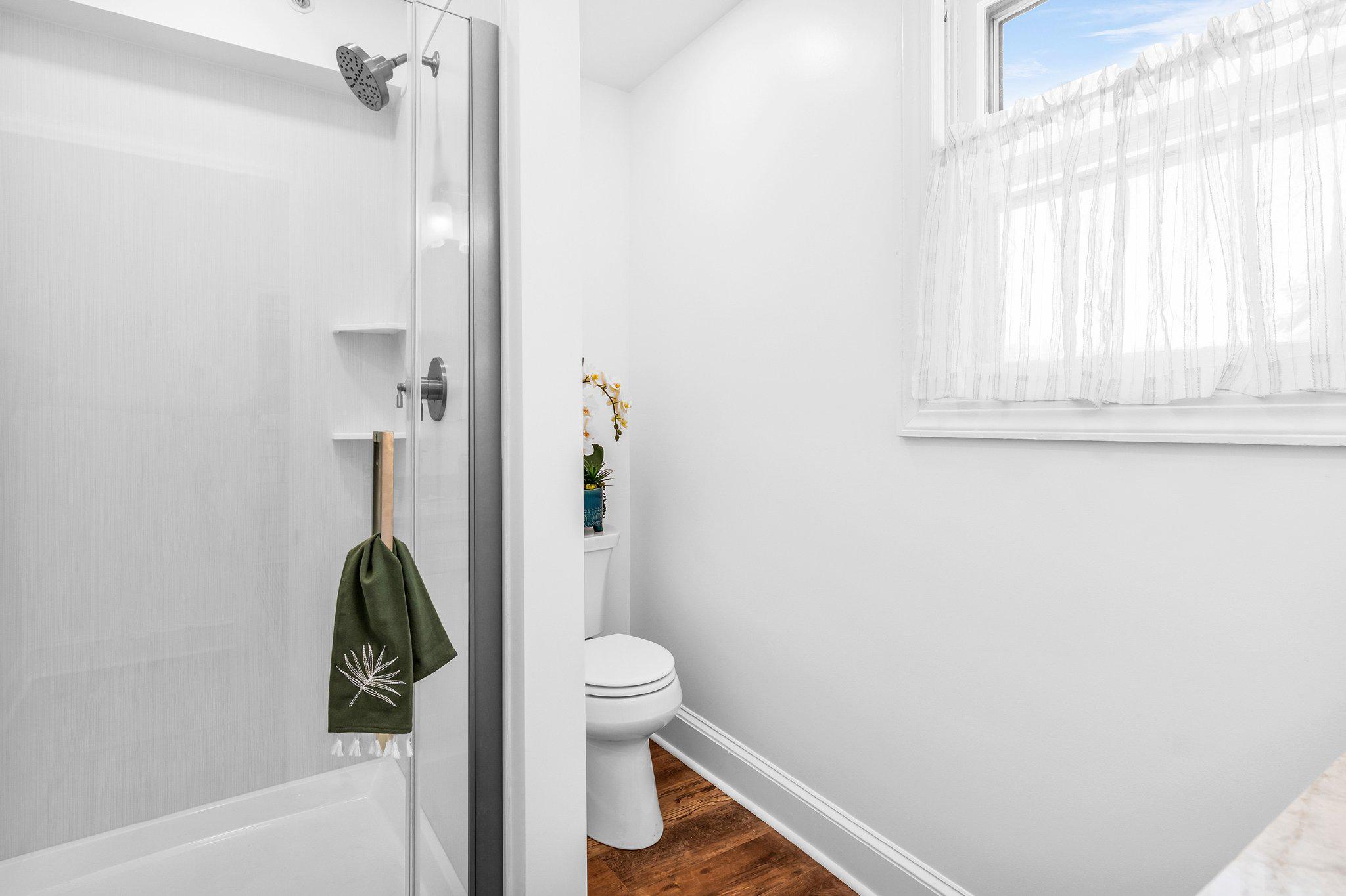 709 Church Street Cambridge, MD 21613 - Photo 24 of 36 a bathroom with a toilet and a shower