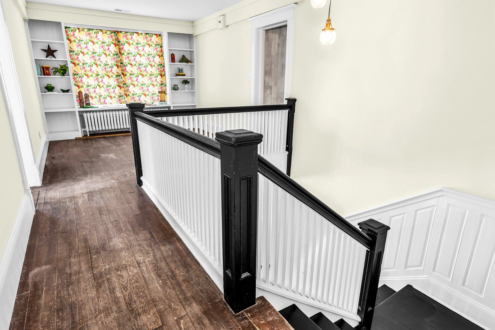 709 Church Street Cambridge, MD 21613 - Photo 26 of 36 a view of a hallway with wooden floor and staircase