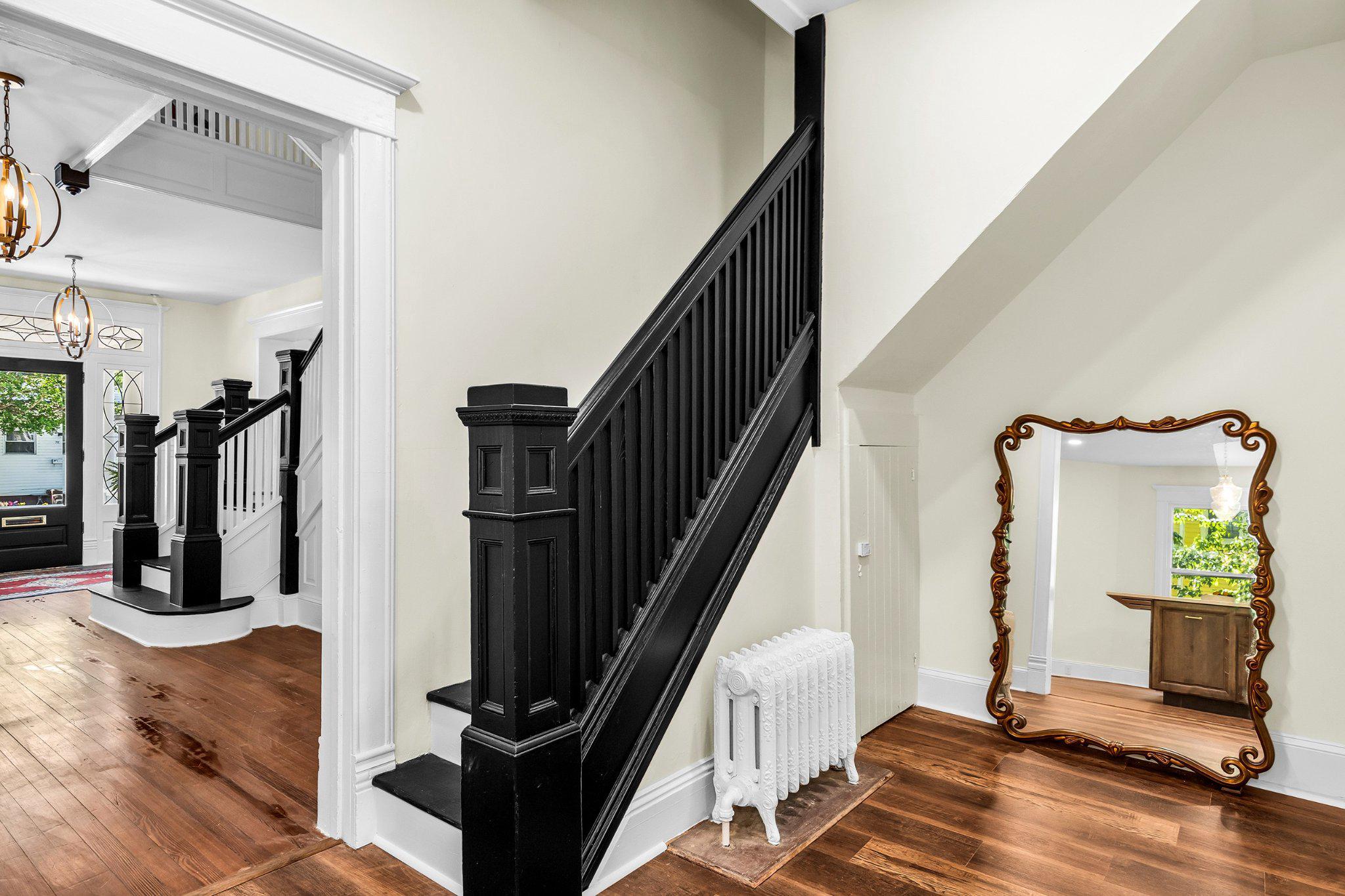 709 Church Street Cambridge, MD 21613 - Photo 10 of 36 a view of a hallway with wooden floor and windows