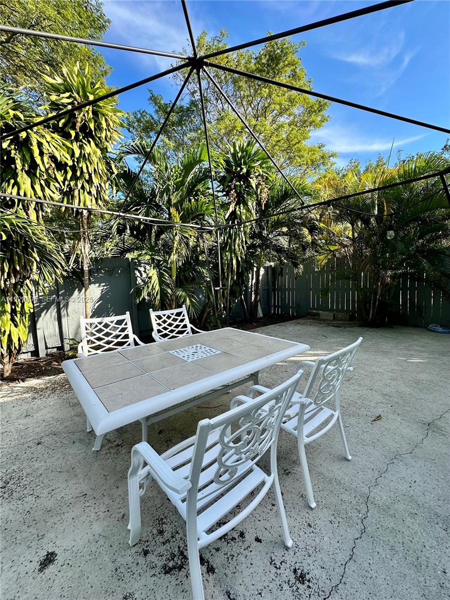 1788 Northeast 169th Street, Unit 1 North Miami Beach, FL 33162 - Photo 15 of 19 a view of an outdoor space with seating