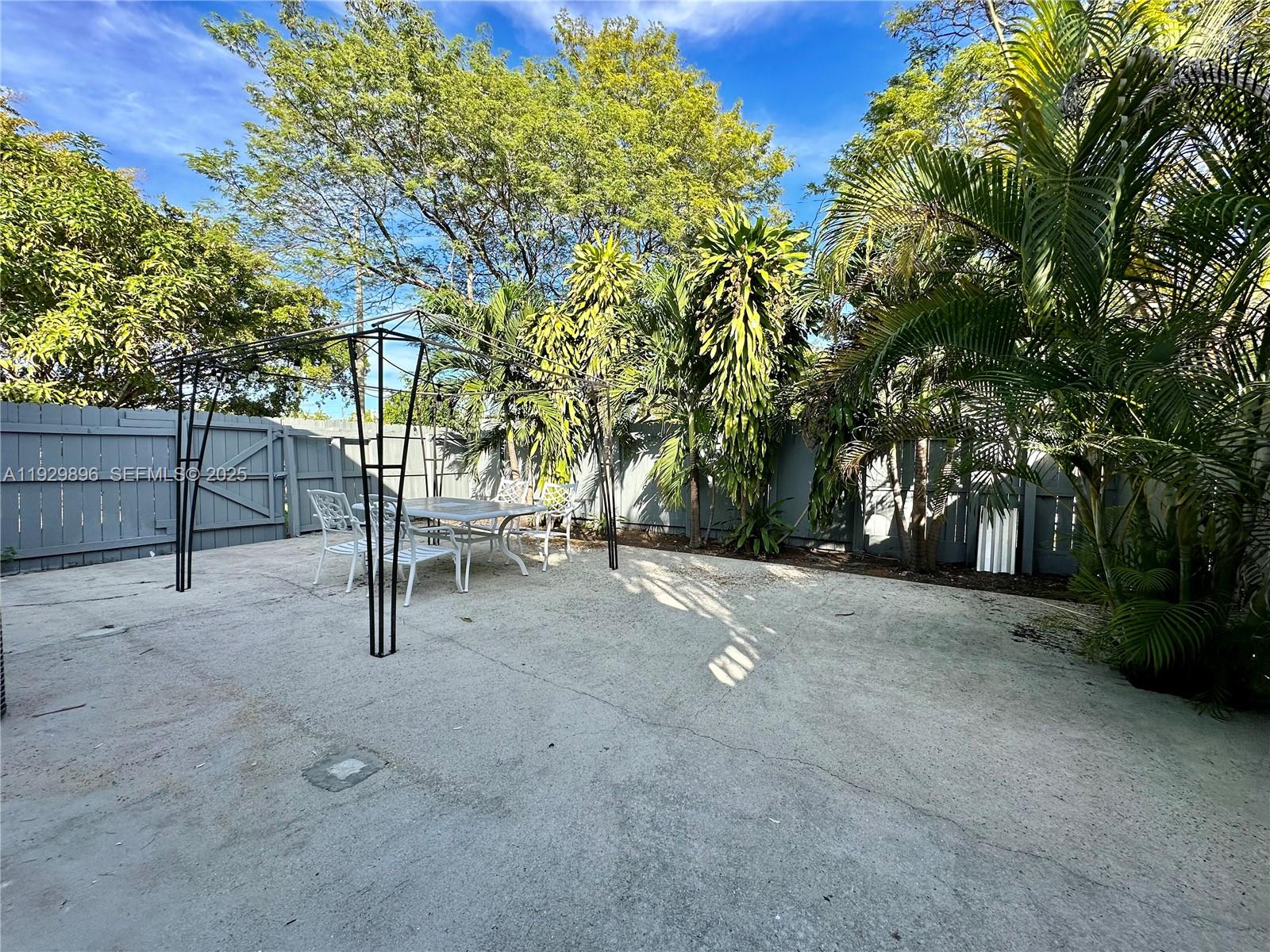 1788 Northeast 169th Street, Unit 1 North Miami Beach, FL 33162 - Photo 18 of 19 a view of outdoor space and yard