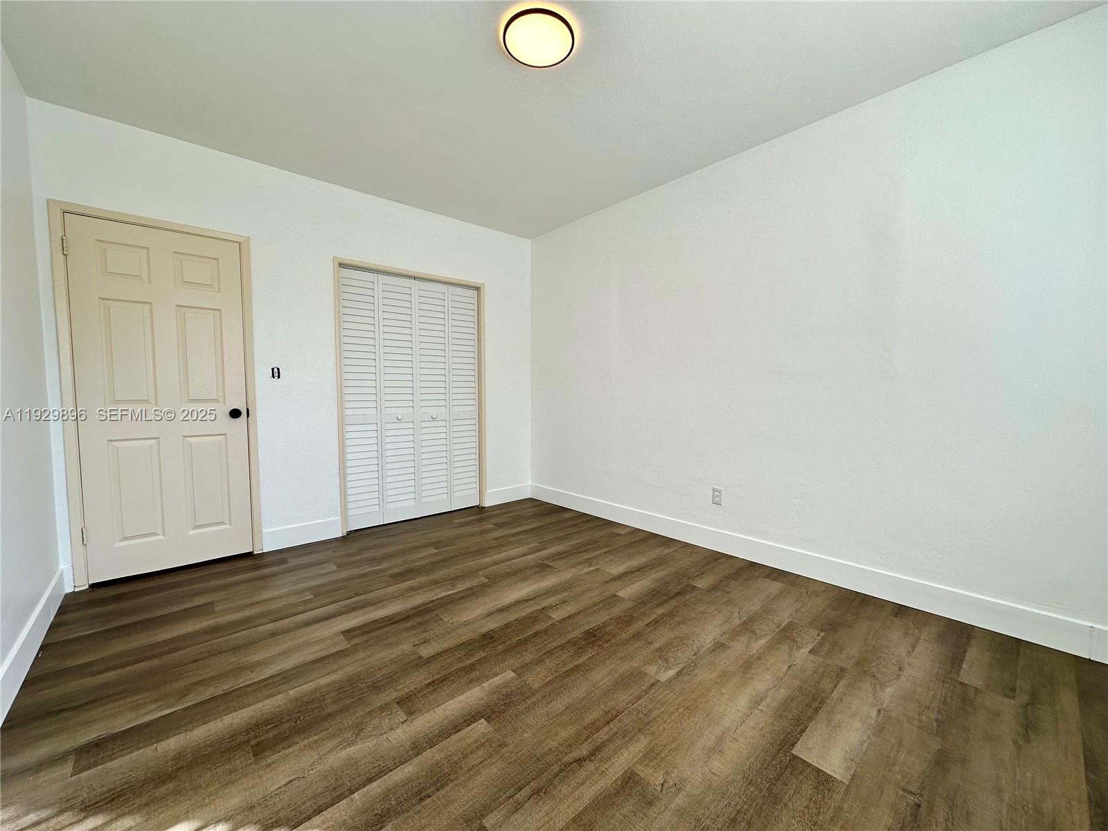 1788 Northeast 169th Street, Unit 1 North Miami Beach, FL 33162 - Photo 10 of 19 a view of empty room