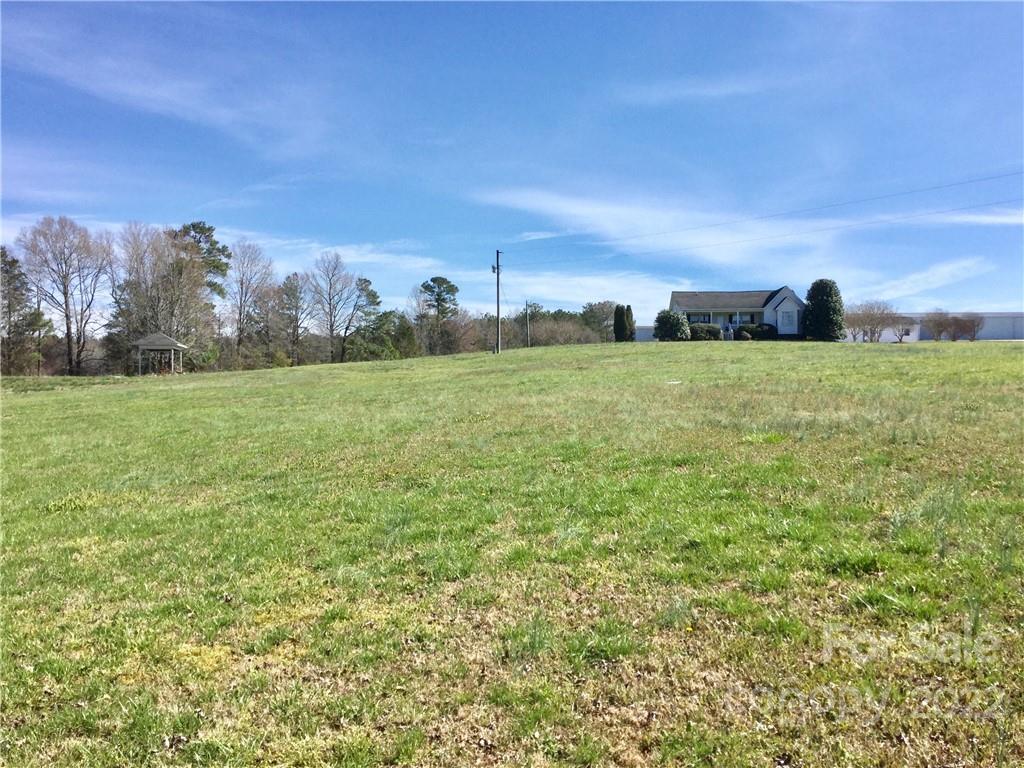 3371 Flat Creek Road Lancaster, SC 29720 - Photo 11 of 38 a view of grassy field with trees in the background