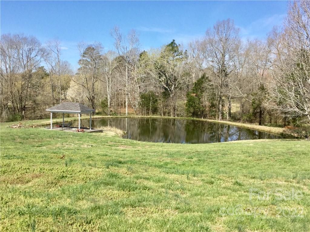3371 Flat Creek Road Lancaster, SC 29720 - Photo 12 of 38 a view of a garden with a house