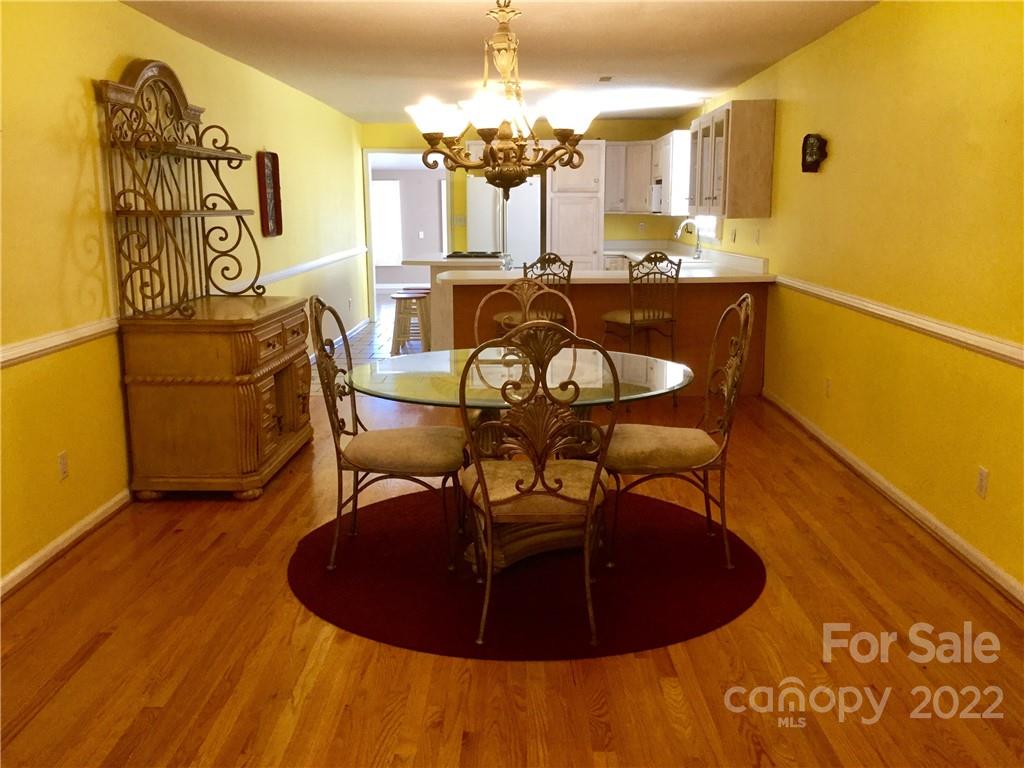 3371 Flat Creek Road Lancaster, SC 29720 - Photo 15 of 38 a view of a dining room with furniture and chandelier