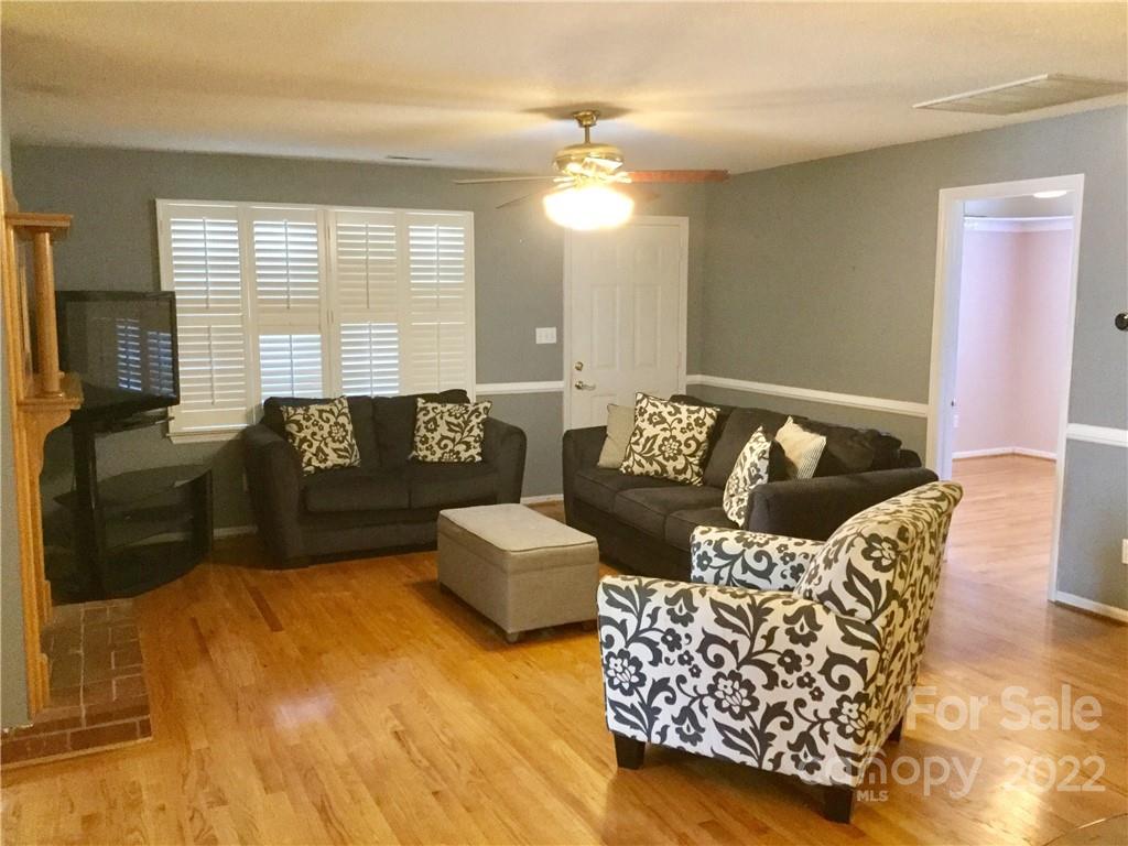 3371 Flat Creek Road Lancaster, SC 29720 - Photo 17 of 38 a living room with furniture and a large mirror next to a window
