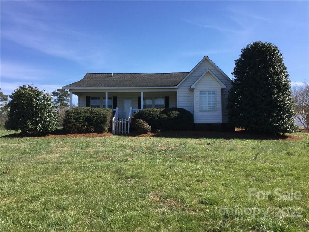3371 Flat Creek Road Lancaster, SC 29720 - Photo 2 of 38 a front view of a house with garden