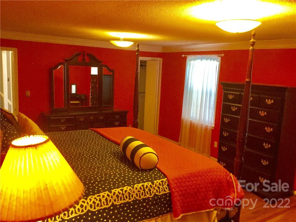 3371 Flat Creek Road Lancaster, SC 29720 - Photo 22 of 38 a bedroom with a bed and a lamp