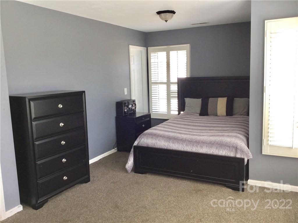 3371 Flat Creek Road Lancaster, SC 29720 - Photo 27 of 38 a bedroom with a bed and a dresser