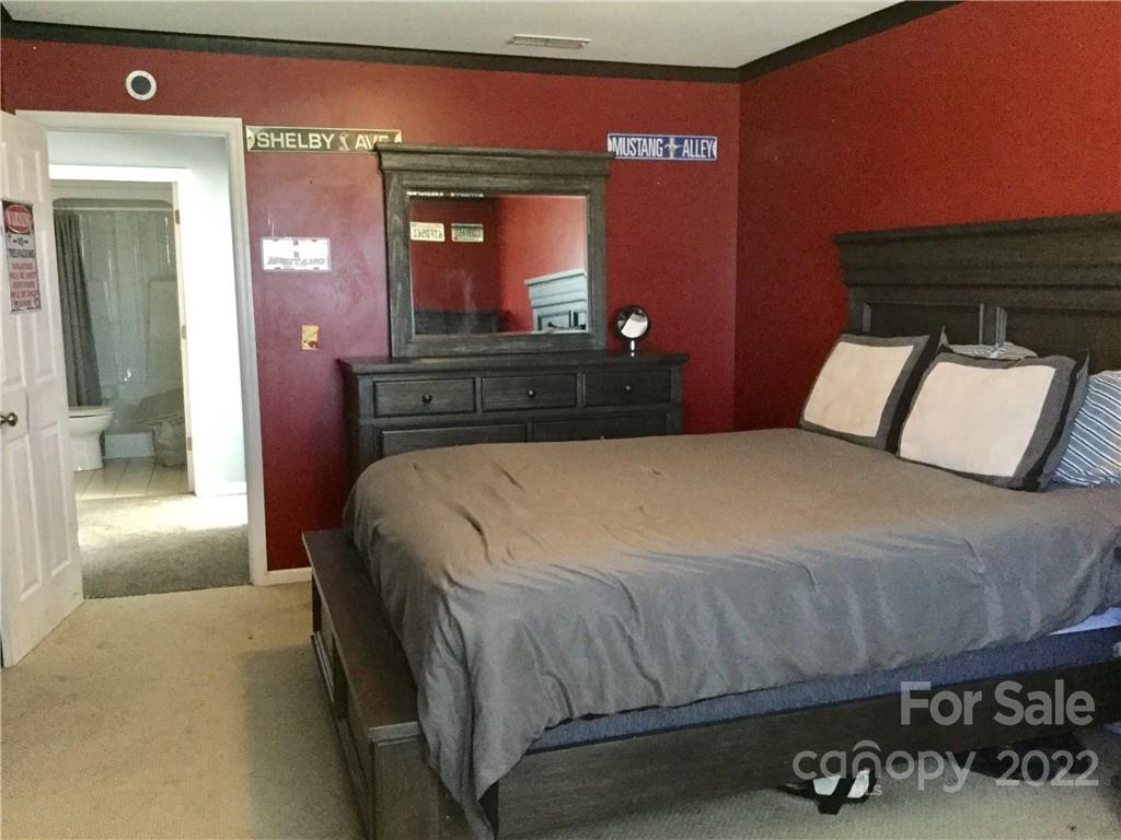 3371 Flat Creek Road Lancaster, SC 29720 - Photo 29 of 38 a bedroom with a large bed and a dresser