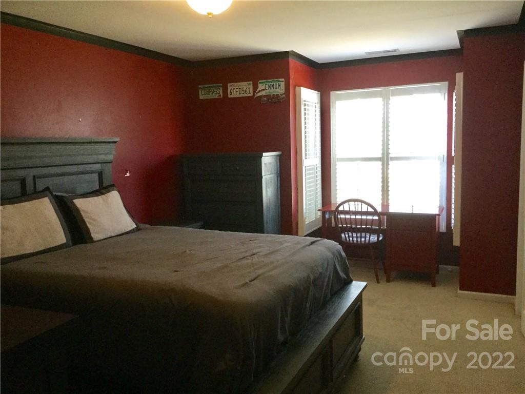 3371 Flat Creek Road Lancaster, SC 29720 - Photo 30 of 38 a bedroom with a bed and a window