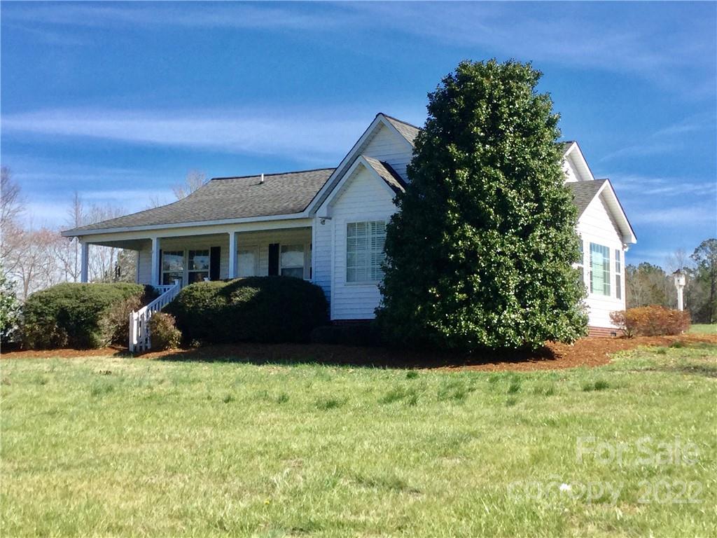3371 Flat Creek Road Lancaster, SC 29720 - Photo 3 of 38 a front view of a house with a yard