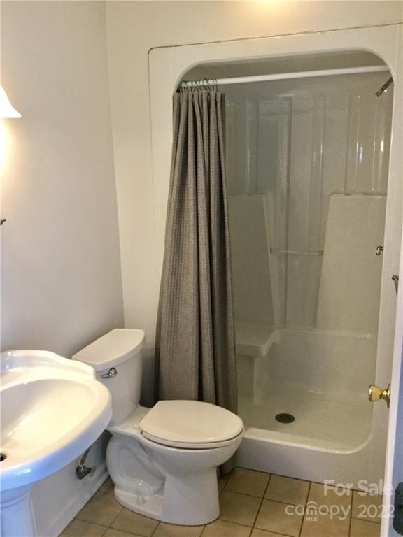 3371 Flat Creek Road Lancaster, SC 29720 - Photo 33 of 38 a white toilet sitting next to a bath tub