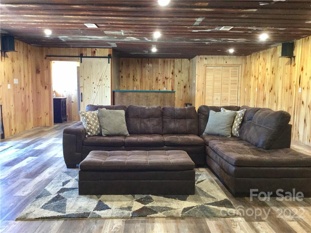 3371 Flat Creek Road Lancaster, SC 29720 - Photo 35 of 38 a living room with furniture and a wooden floor