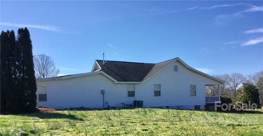 3371 Flat Creek Road Lancaster, SC 29720 - Photo 7 of 38 a front view of house with yard and trees in the background
