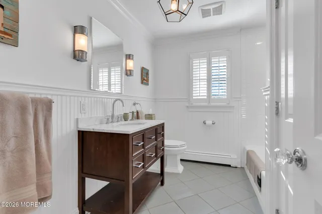 a bathroom with a sink double vanity and a mirror