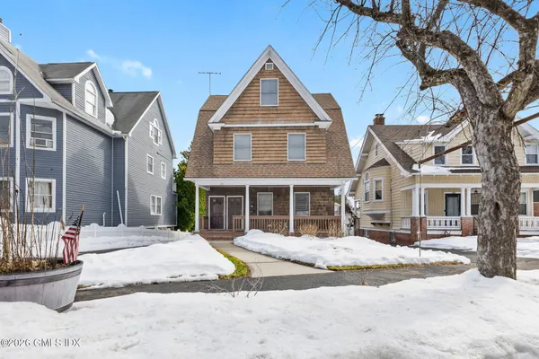 a front view of a house with a yard