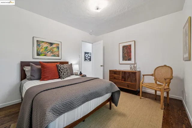 a bedroom with bed and a chandelier