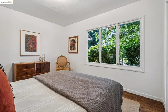 a bedroom with a large bed and a window