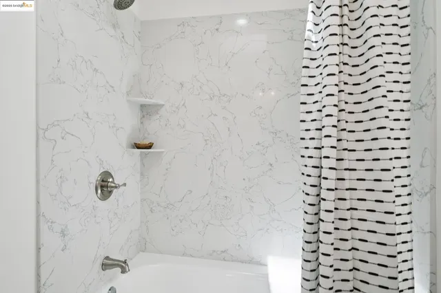 a bathroom with a shower curtain