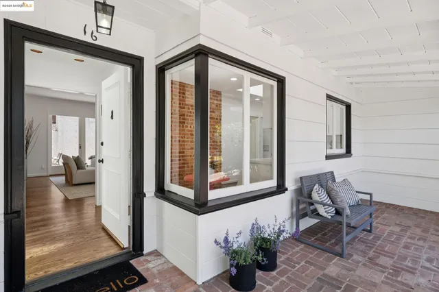 a view of a livingroom with furniture and hardwood floor