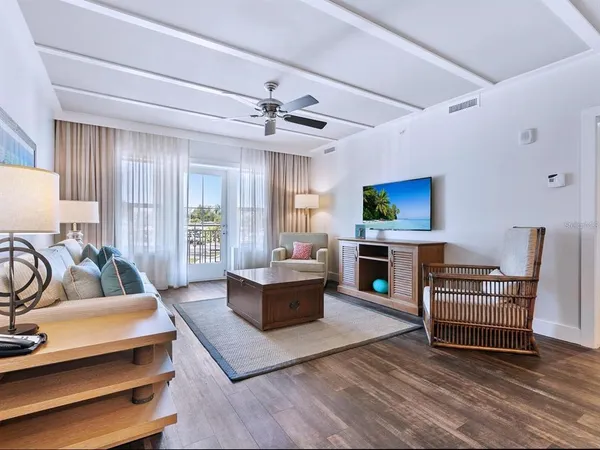 a room with furniture and ceiling fan
