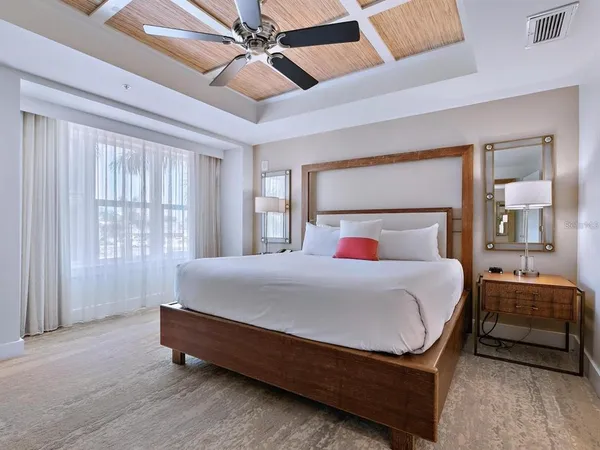 a room with a bed and utility room