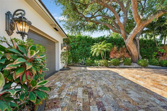 a kitchen with granite countertop a refrigerator sink and stove