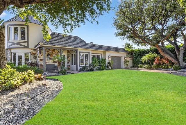a backyard of a house with lots of green space