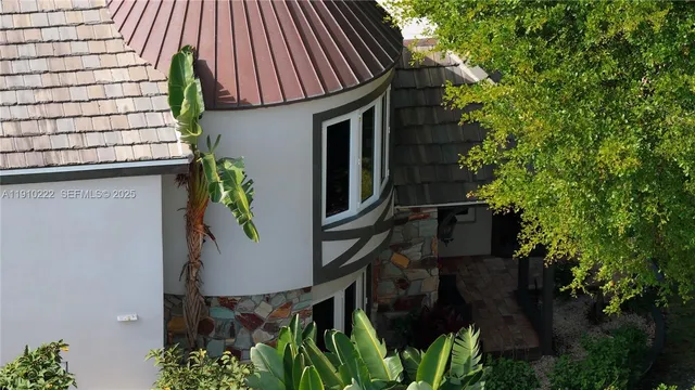 a view of a chair and table in the garden