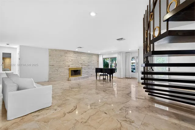 a view of a backyard with sitting area