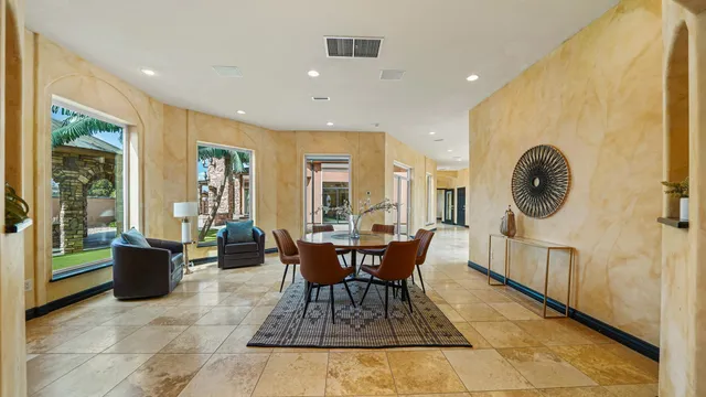 a view of a dining room with furniture window and outside view