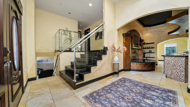 a living room with a couch and a rug