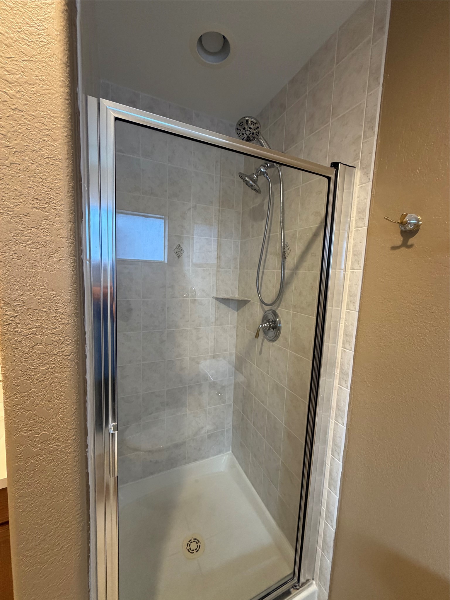 9110 Prairie Trails Drive Spring, TX 77379 - Photo 15 of 34 a bathroom with a glass shower door