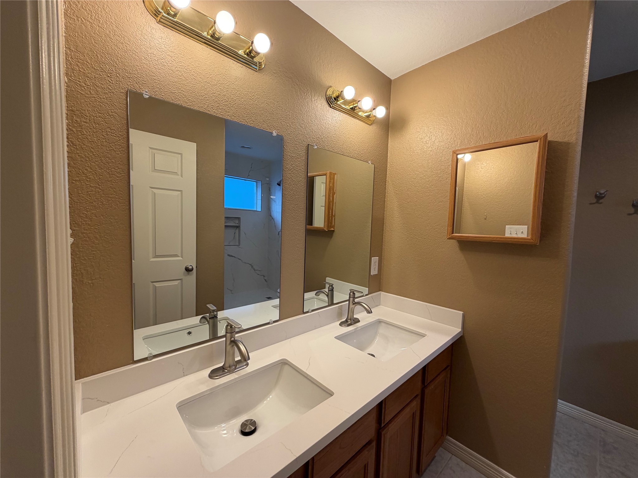 9110 Prairie Trails Drive Spring, TX 77379 - Photo 18 of 34 a bathroom with a sink and a mirror